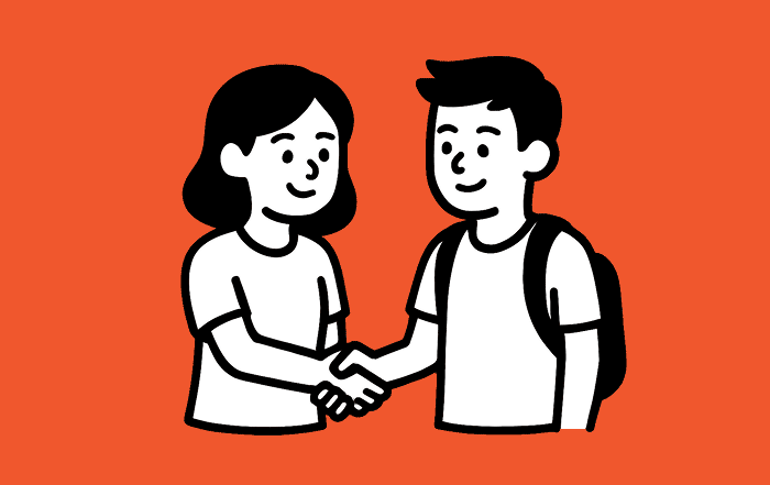 Dos estudiantes se saludan con un apretón de manos, representando la convivencia, el respeto y la comunicación entre pares.